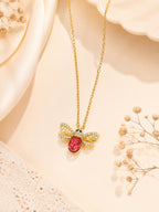 Red Stone Wing Charm Necklace with 18K Gold Plating