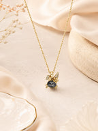 Winged Dark Stone Necklace with 18K Gold Plating