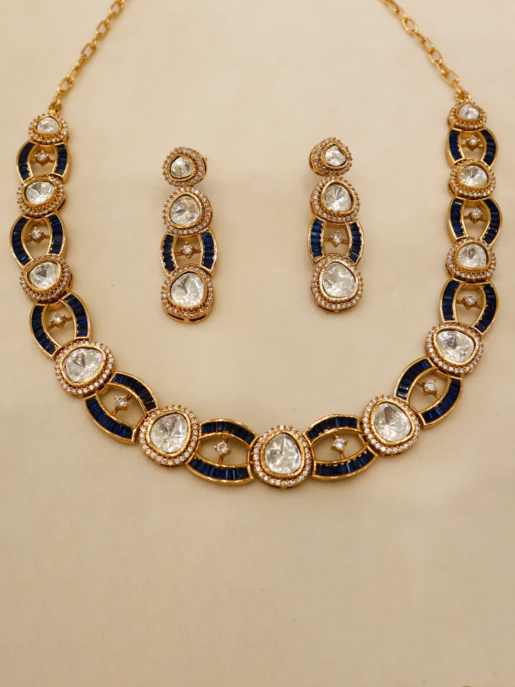 Aanura Oval Kundan Linked Necklace & Earrings