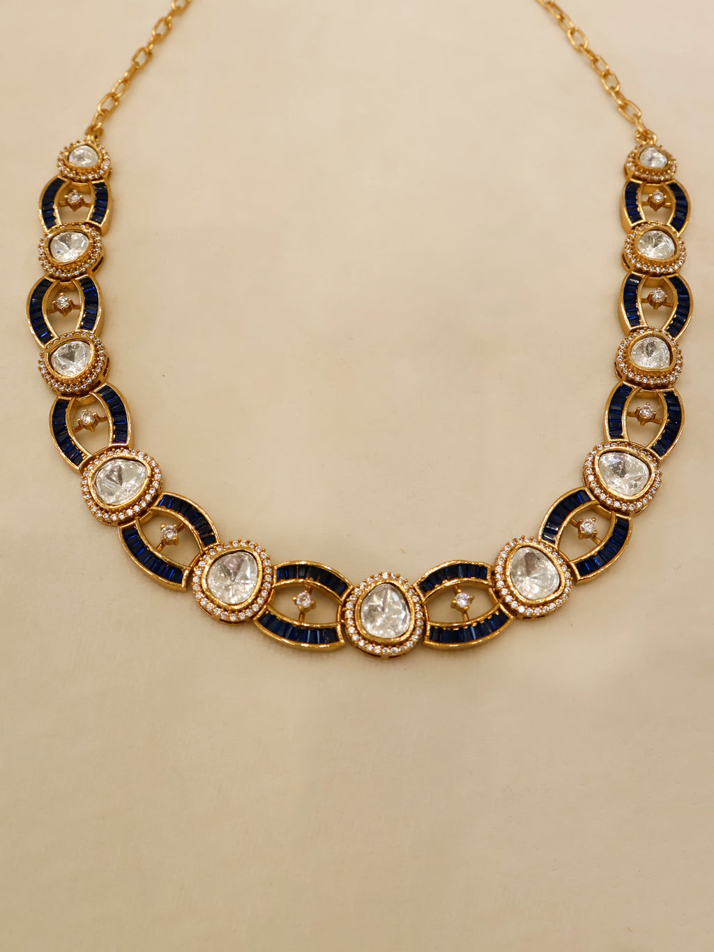 Aanura Oval Kundan Linked Necklace & Earrings
