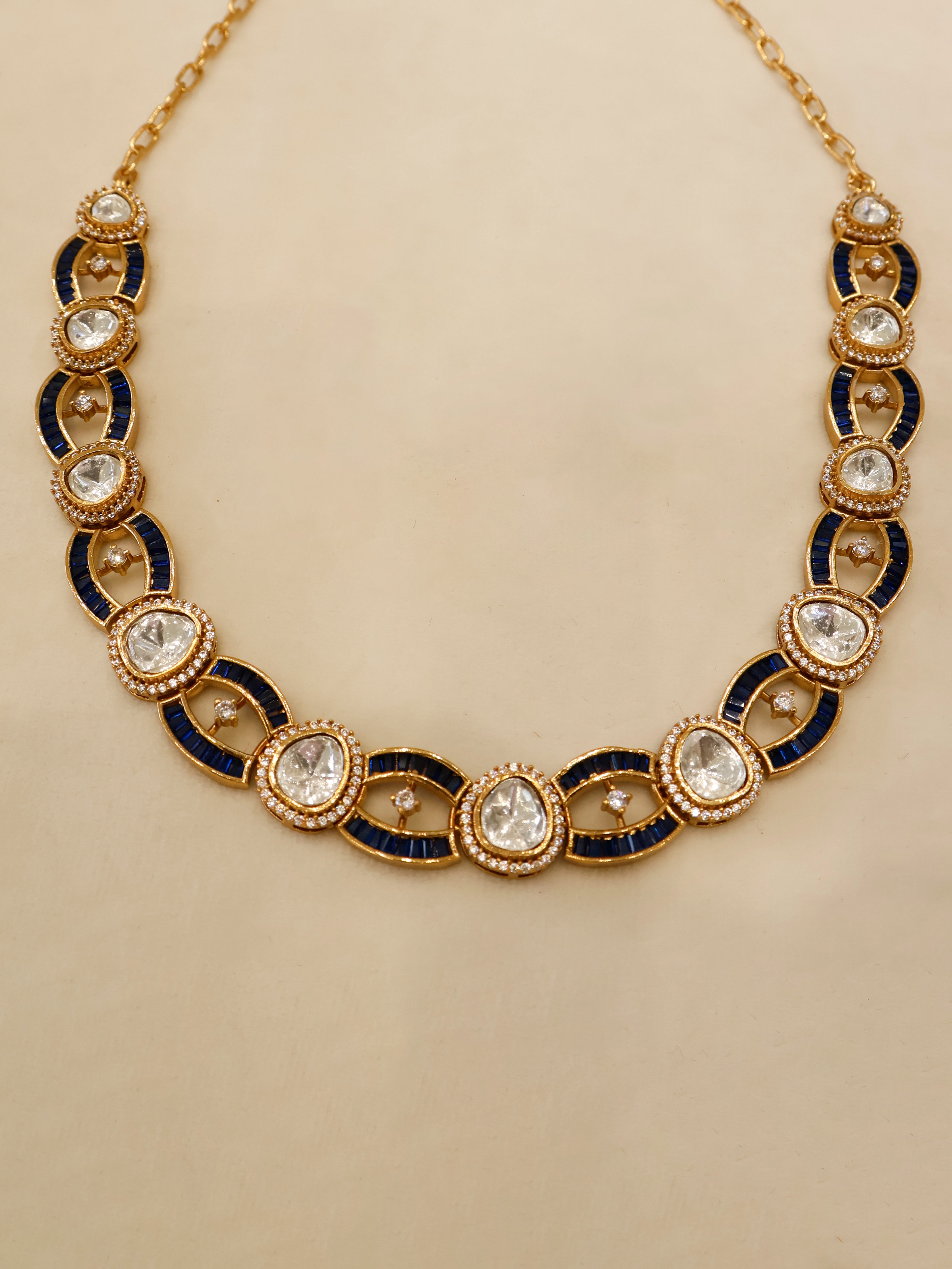 Aanura Oval Kundan Linked Necklace & Earrings
