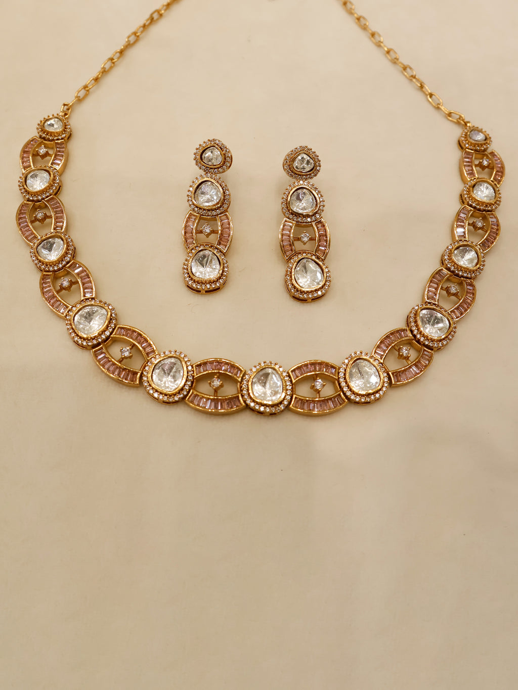 Aanura Oval Kundan Linked Necklace & Earrings