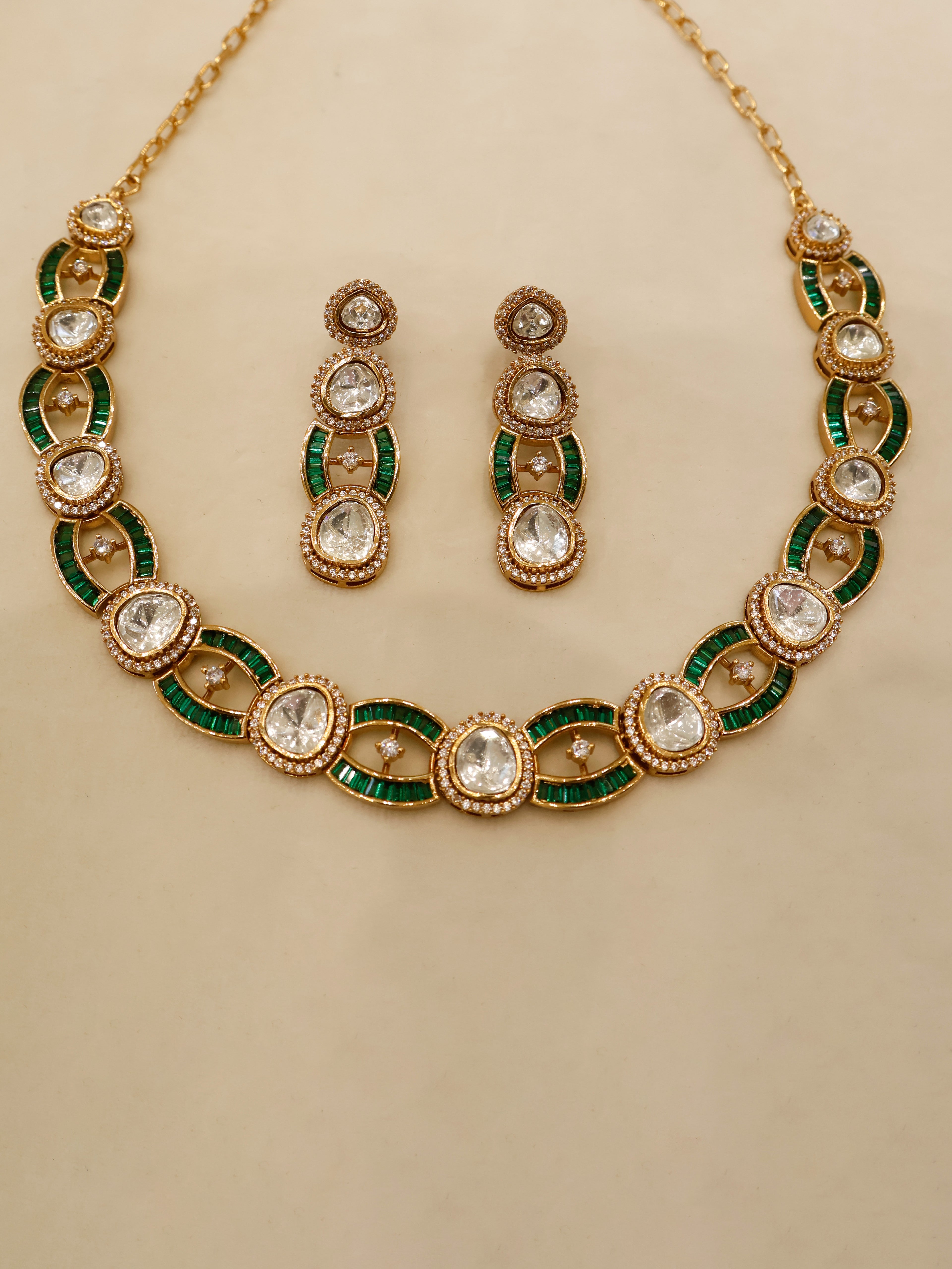 Aanura Oval Kundan Linked Necklace & Earrings