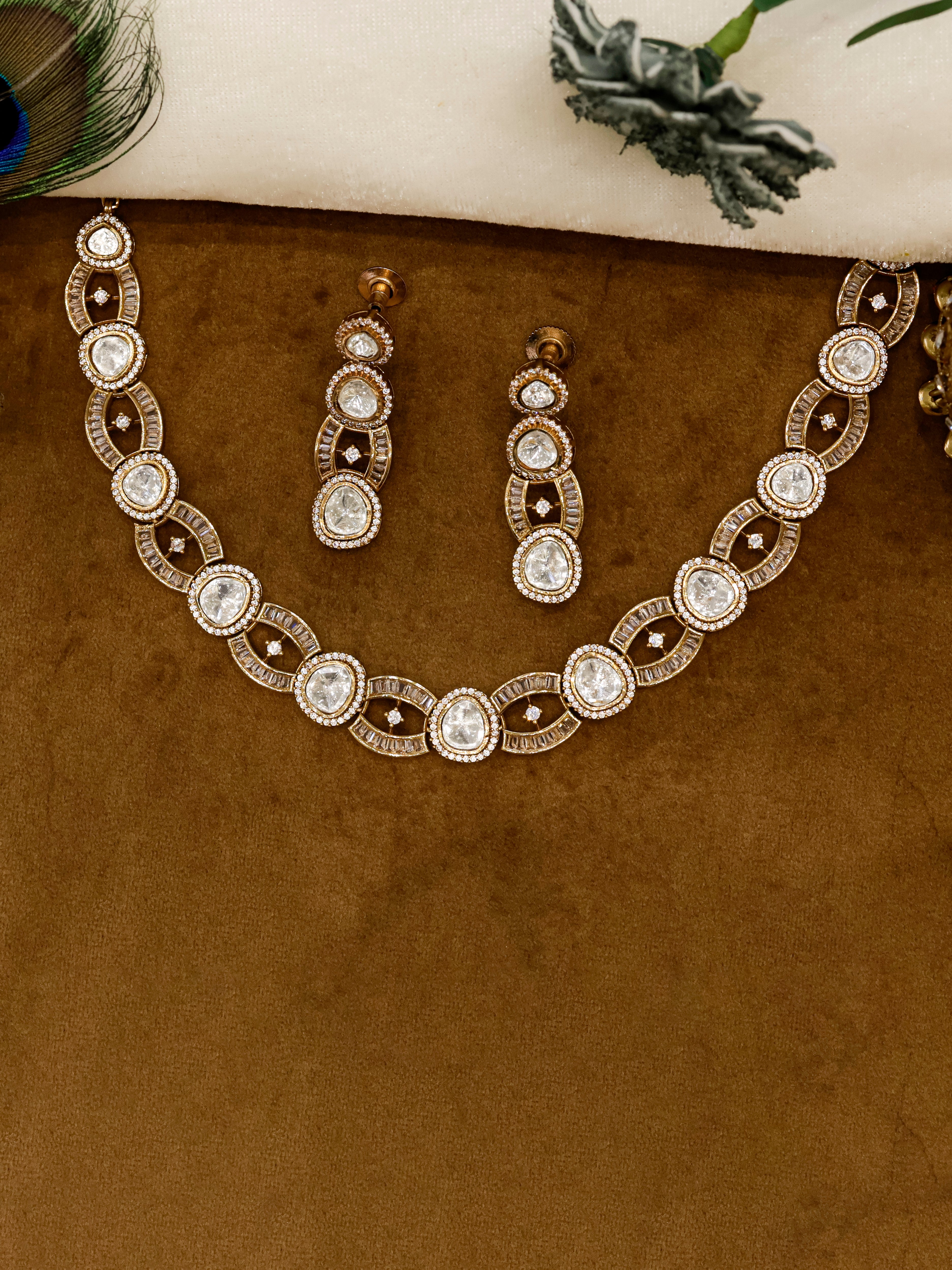 Aanura Oval Kundan Linked Necklace & Earrings